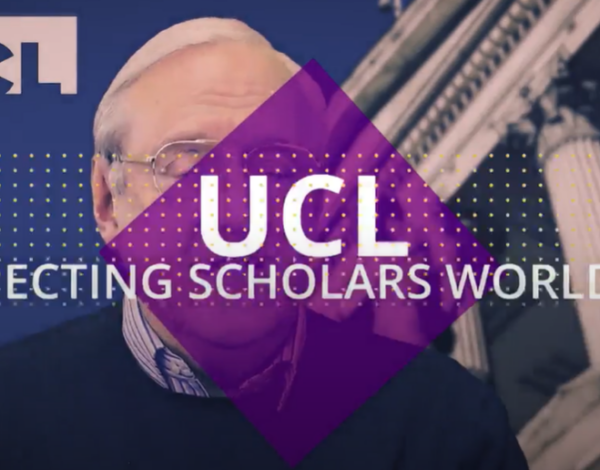 Screenshot from video. Purple diamond superimposed over a man (UCL Press CEO, Paul Ayris) talking. White text reads: 'UCL: Connecting scholars worldwide'