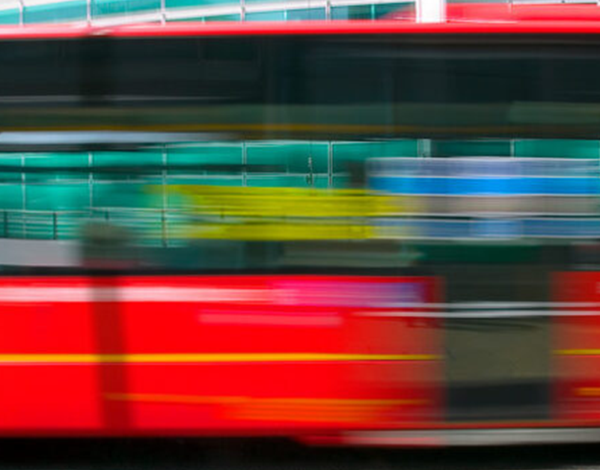 Image of a blurred red bus